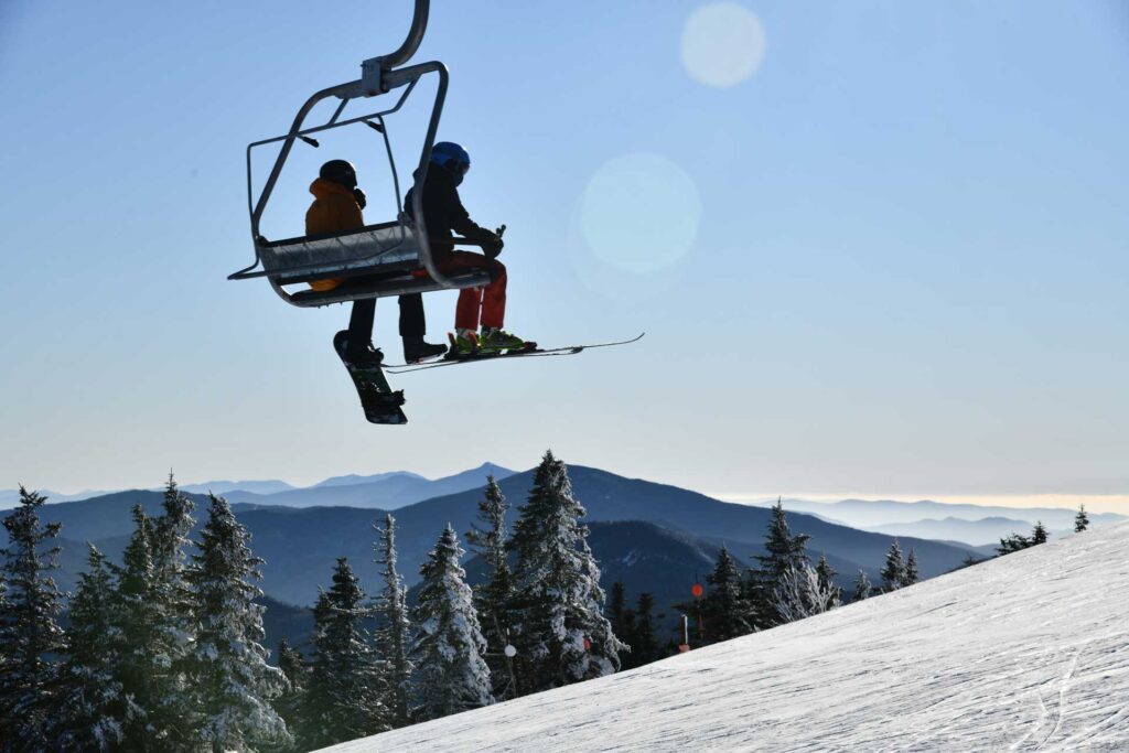 two people on a chairlift in the winter