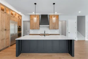 Large kitchen with wood cabinets and a black island