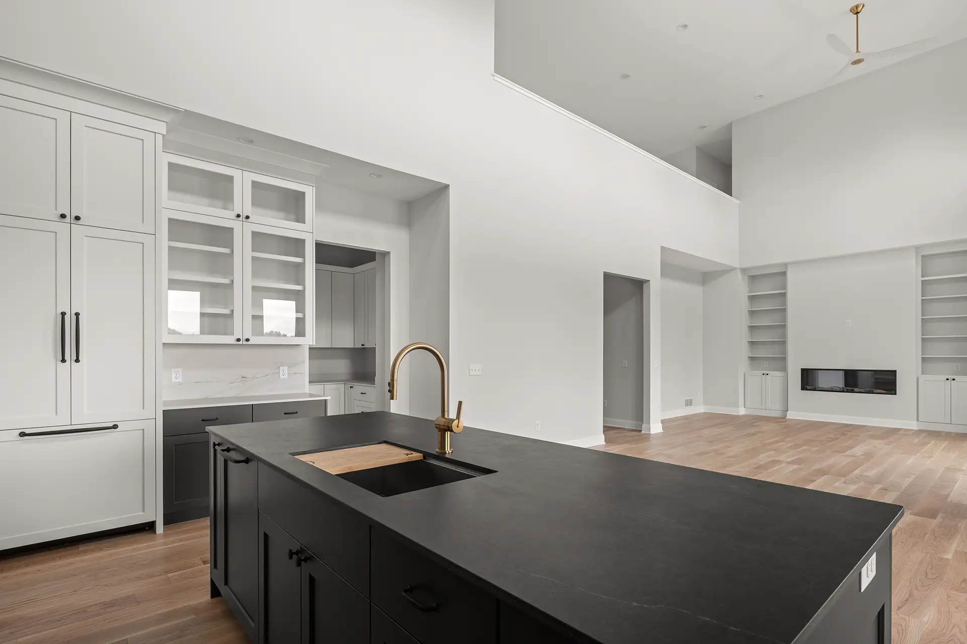 black island gold faucet two story open great room fireplace