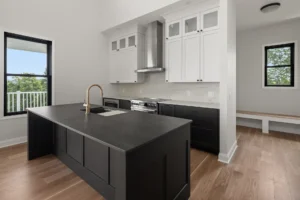 black island gold faucet white upper cabinets range hood views