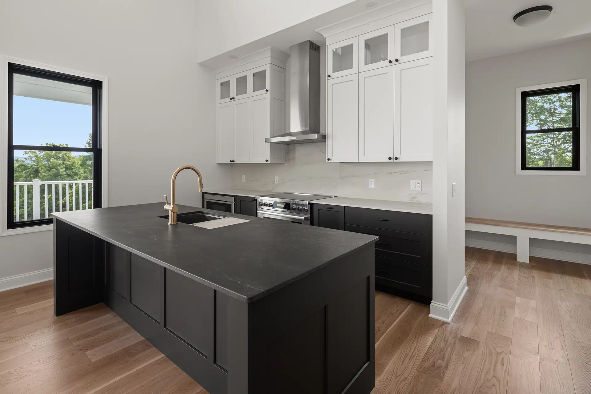 black island gold faucet white upper cabinets range hood views