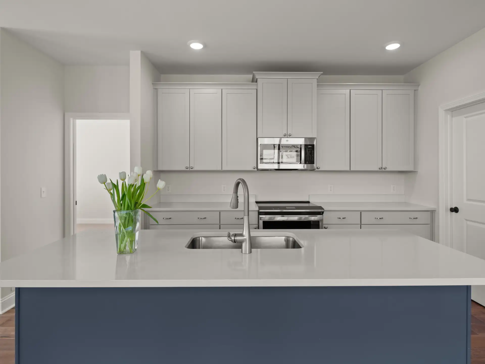 blue island sink tulips gray cabinets front view