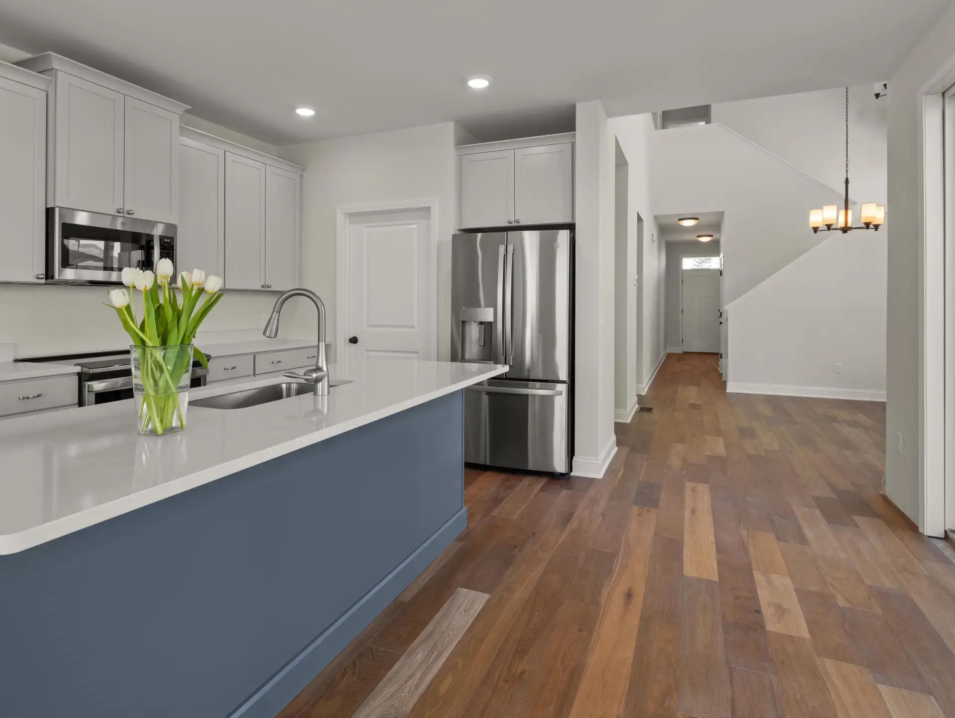 blue island tulips stainless fridge hallway view
