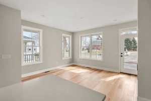 bright dining area multiple windows exterior door