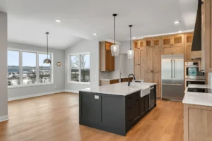 dark island farmhouse sink tall wood cabinets snowy view