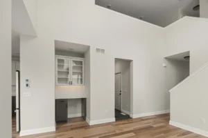 foyer built in desk nook high ceiling staircase