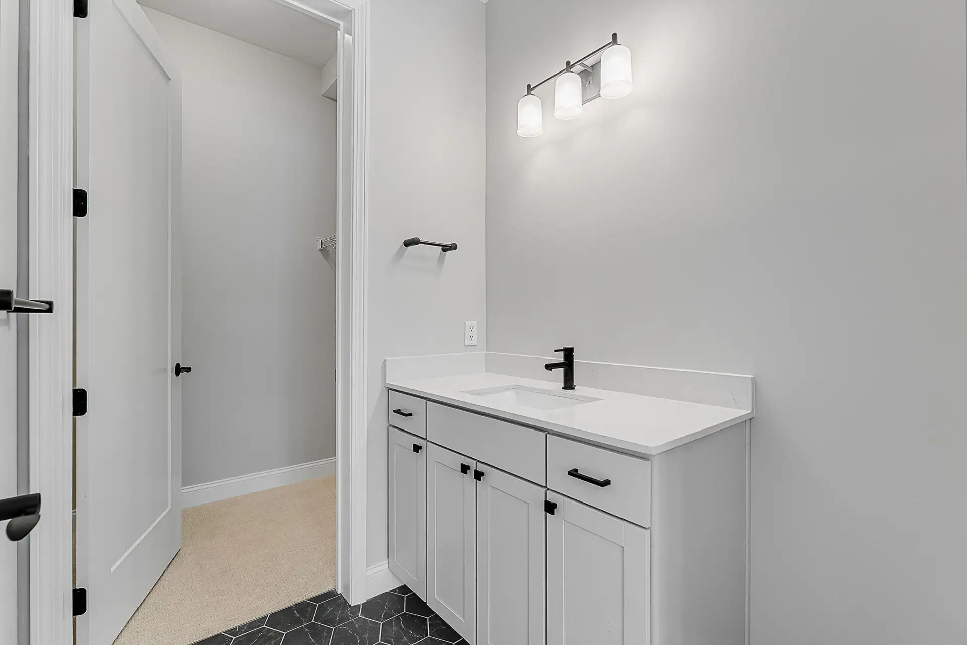 grey bathroom vanity walk in closet view