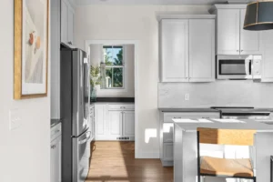 kitchen view toward pantry stainless fridge marble backsplash