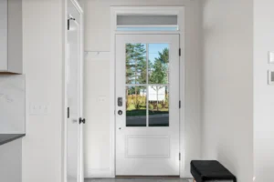 mudroom glass panel entry door transom window tree view