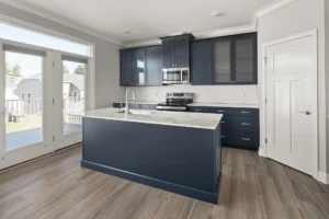 navy kitchen island herringbone backsplash marble countertop deck door