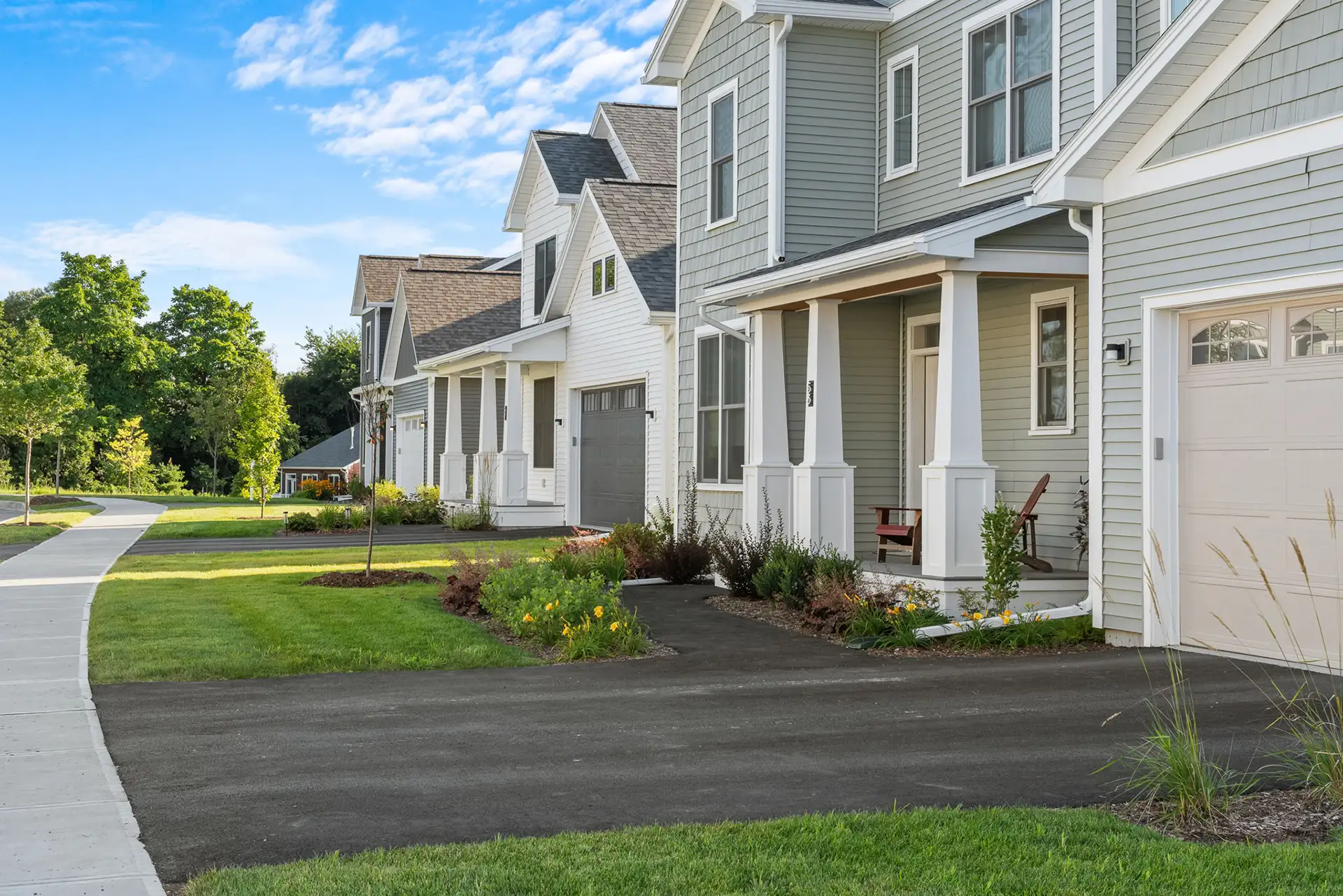 neighborhood street with craftsman homes and covered porches