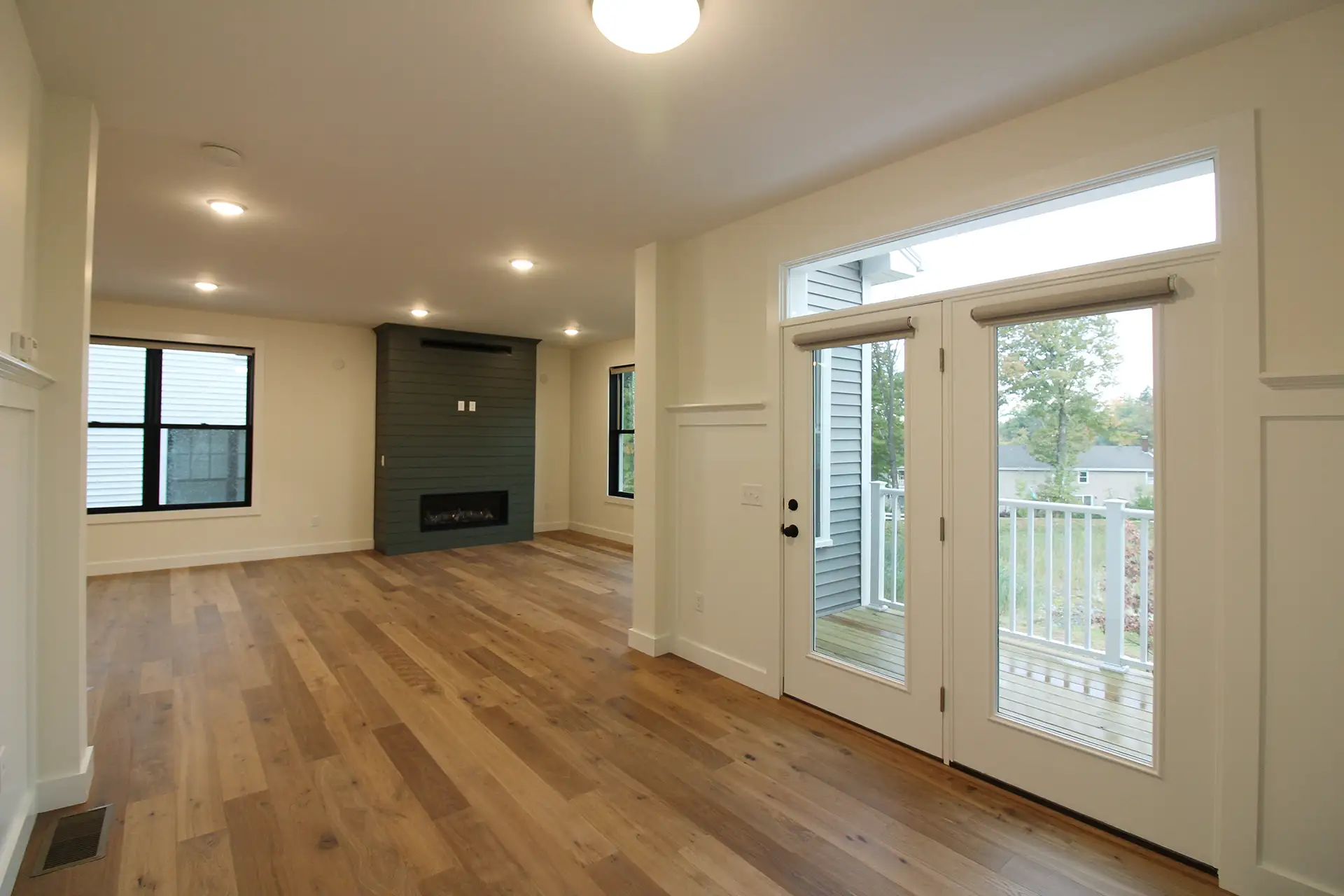open living room french doors shiplap fireplace