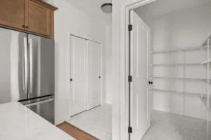 open pantry wire shelves stainless fridge marble tile floor