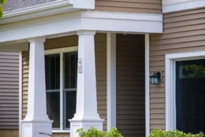 porch column close up with house number and black entry door