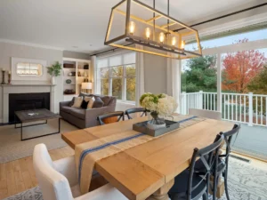 staged dining room wood table pendant light deck view