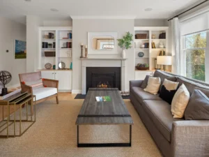 staged living room white mantel fireplace built in bookcases