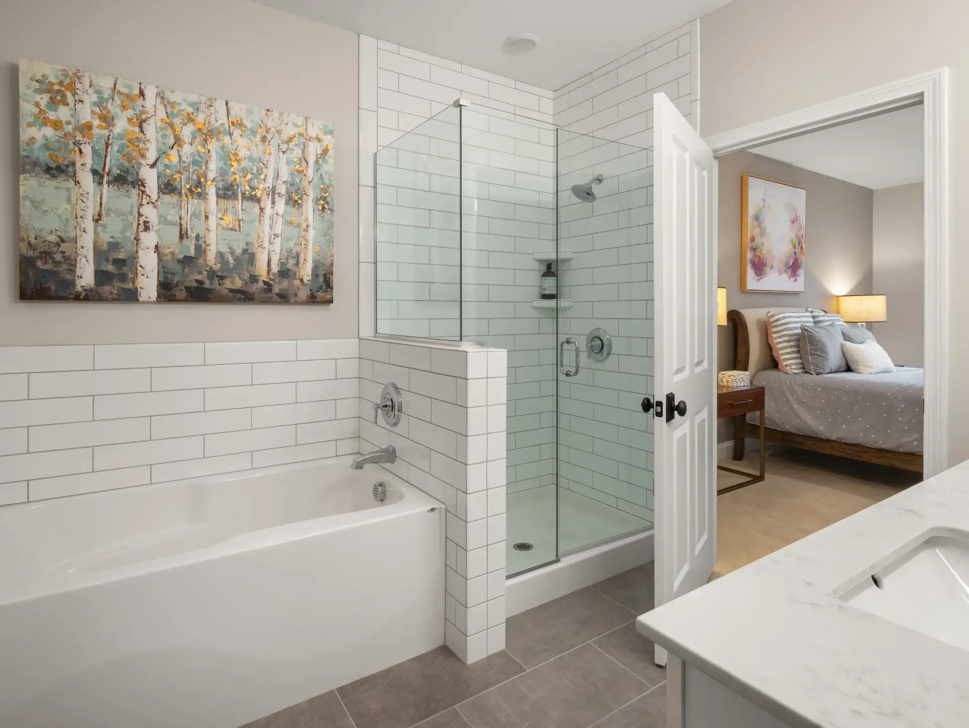 subway tile tub shower combo with birch tree art
