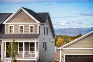 white home rear with solar panels upper deck and patio fire bowl