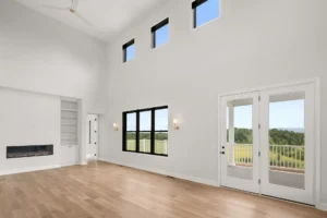 two story great room clerestory windows deck view