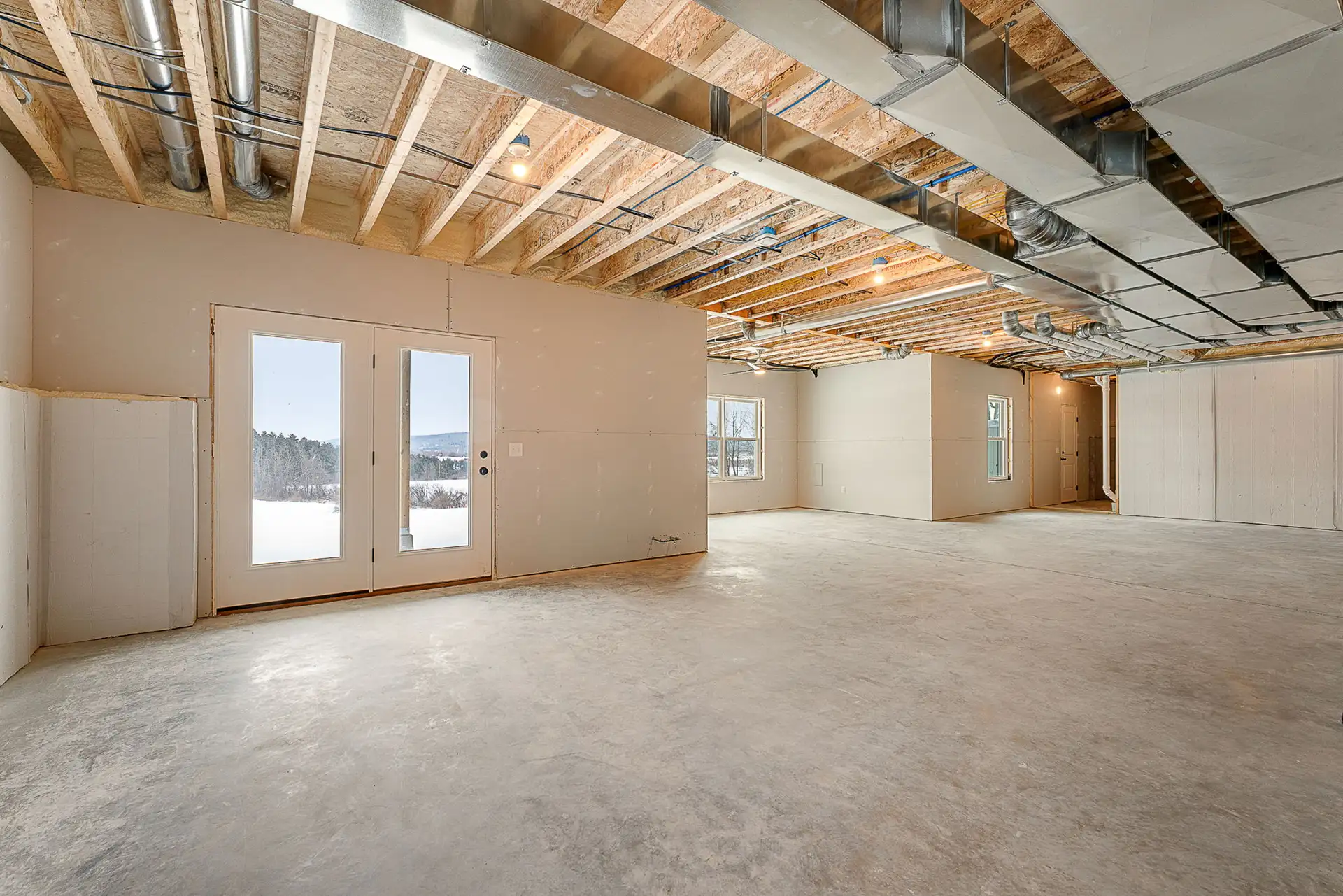 unfinished basement concrete floor french doors mountain view