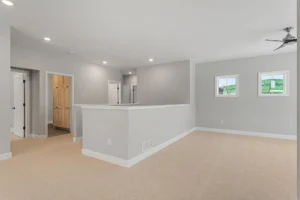 upper hallway landing with staircase and wood closet doors