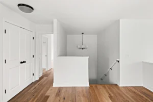 upstairs hallway hardwood floor staircase chandelier