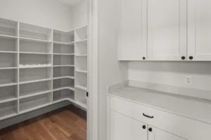 walk in pantry white wire shelves wine rack adjacent cabinets