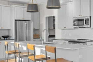 white kitchen close up island barstools pantry door