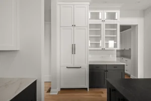 white tall cabinet column glass upper shelves two islands